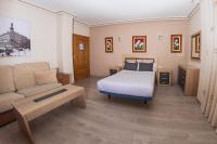 Postel nebo postele na pokoji v ubytování Hostal El Cruce
