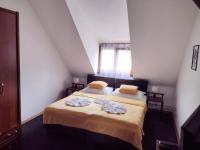 Postel nebo postele na pokoji v ubytování Hotel PODKOST
