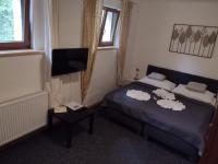 Postel nebo postele na pokoji v ubytování Hotel PODKOST