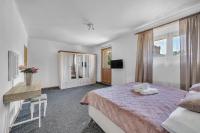 Postel nebo postele na pokoji v ubytování Hotel PODKOST