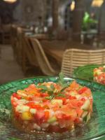 a green plate of food on a table at Riad Eucalyptus, hôtel de charme Essaouira in Essaouira