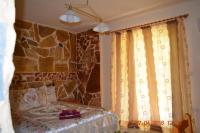Posteľ alebo postele v izbe v ubytovaní Apartments Zoumperi