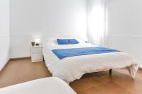 Posteľ alebo postele v izbe v ubytovaní Laramond Barcelona Rooms