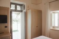 Łóżko lub łóżka w pokoju w obiekcie Masseria Don Luigi-Luxury Farmhouse