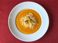a white plate with a bowl of soup with rice at Redil del Paraíso in La Cumbre