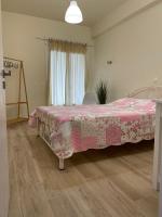 A bed or beds in a room at Kontos Mansion
