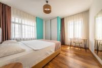 Postel nebo postele na pokoji v ubytování PASHAM RESIDENCE