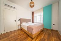 Postel nebo postele na pokoji v ubytování PASHAM RESIDENCE