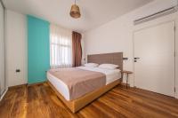 Postel nebo postele na pokoji v ubytování PASHAM RESIDENCE