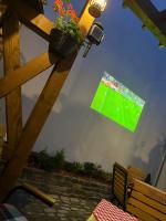 a sign hanging from the ceiling of a soccer field at An der Holztreppe in Sighişoara