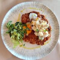 a white plate of food with a salad on it at Dom na Wyłączność z Wanną z Hydromasażem, Sauną i Basenem in Mucharz