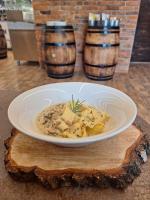a bowl of food on a table with a plate of food at Dom na Wyłączność z Wanną z Hydromasażem, Sauną i Basenem in Mucharz