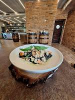 a plate of food sitting on top of a table at Dom na Wyłączność z Wanną z Hydromasażem, Sauną i Basenem in Mucharz