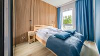 Posteľ alebo postele v izbe v ubytovaní Apartamenty Sun & Snow Let's Sea Baltic Park
