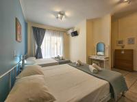 Posteľ alebo postele v izbe v ubytovaní Chariclia Hotel