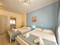 Posteľ alebo postele v izbe v ubytovaní Chariclia Hotel