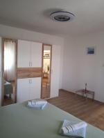 Postel nebo postele na pokoji v ubytování APARTMAN IVANO