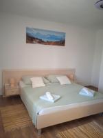 Postel nebo postele na pokoji v ubytování APARTMAN IVANO