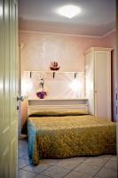 A bed or beds in a room at Hotel Residence Veliero