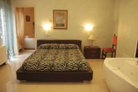 A bed or beds in a room at Hotel Residence Veliero