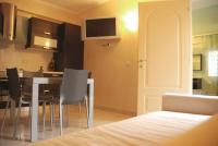 A television and/or entertainment centre at Hotel Residence Veliero