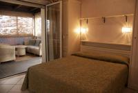 A bed or beds in a room at Hotel Residence Veliero