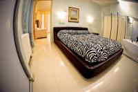 A bed or beds in a room at Hotel Residence Veliero