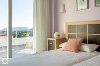 Posteľ alebo postele v izbe v ubytovaní Villa Bernia by Abahana Villas
