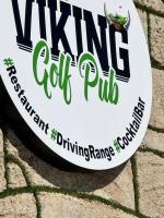 a sign for a wine golf pub on a brick wall at BELKA GOLF RESİDENCE Dublex BELEK in Belek