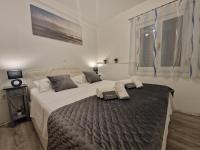 Posteľ alebo postele v izbe v ubytovaní Apartments MB