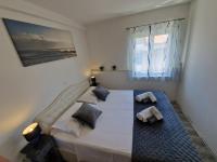 Posteľ alebo postele v izbe v ubytovaní Apartments MB