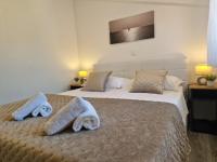 Posteľ alebo postele v izbe v ubytovaní Apartments MB