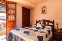 A bed or beds in a room at Casa Enrique en el oriente de Asturias