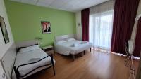 Łóżko lub łóżka w pokoju w obiekcie Hotel Lago Losetta
