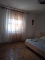 Postel nebo postele na pokoji v ubytování APARTMAN IVANO