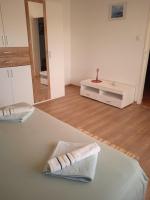 Postel nebo postele na pokoji v ubytování APARTMAN IVANO