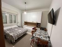 A bed or beds in a room at Hotel Fioralba