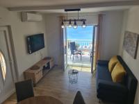 Televízia a/alebo spoločenská miestnosť v ubytovaní Apartments by the sea Cove Saplunara, Mljet - 12849