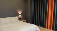 7 Days Inn Fucheng Wu Gongci Gaodeng East Street Binjiang Roadにあるベッド