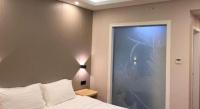7 Days Inn Fucheng Wu Gongci Gaodeng East Street Binjiang Roadにあるベッド