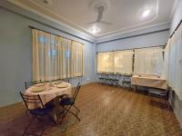 a room with a table and chairs in it at Hotel City Gold - Hotel in Dharamshala in Dharmsala