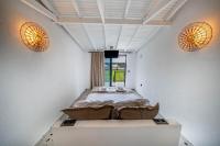 Postel nebo postele na pokoji v ubytování Thanos Hotel