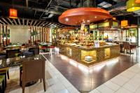 a restaurant with a bar and some tables and chairs at Waterfront Cebu City Hotel & Casino in Cebu City