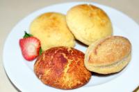a plate of food with biscuits and a strawberry at Sintra Boutique Hotel in Sintra