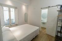 Postel nebo postele na pokoji v ubytování Apartamentos La Cruz Verde