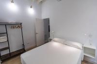 Postel nebo postele na pokoji v ubytování Apartamentos La Cruz Verde