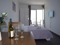 Posteľ alebo postele v izbe v ubytovaní APARTMENTS KING 2
