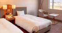 Imazu Sun Bridge Hotelにあるベッド