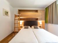Łóżko lub łóżka w pokoju w obiekcie Luxury Chalet in Saalbach-Hinterglemm with Sauna