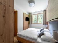 Łóżko lub łóżka w pokoju w obiekcie Luxury Chalet in Saalbach-Hinterglemm with Sauna